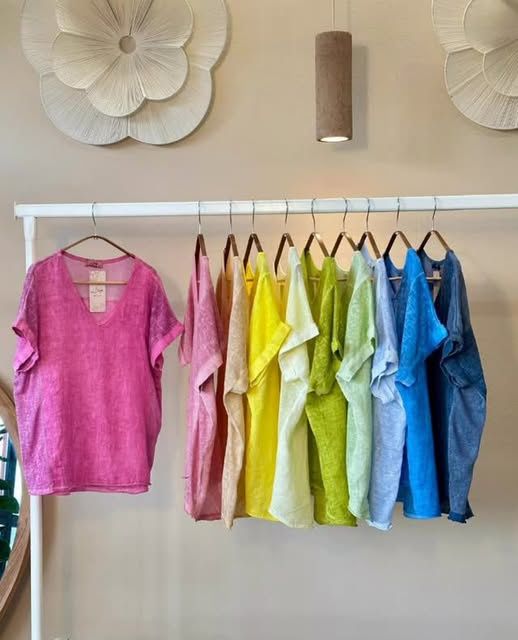 A rainbow of washed-linen tops on the rack, pink through denim blue